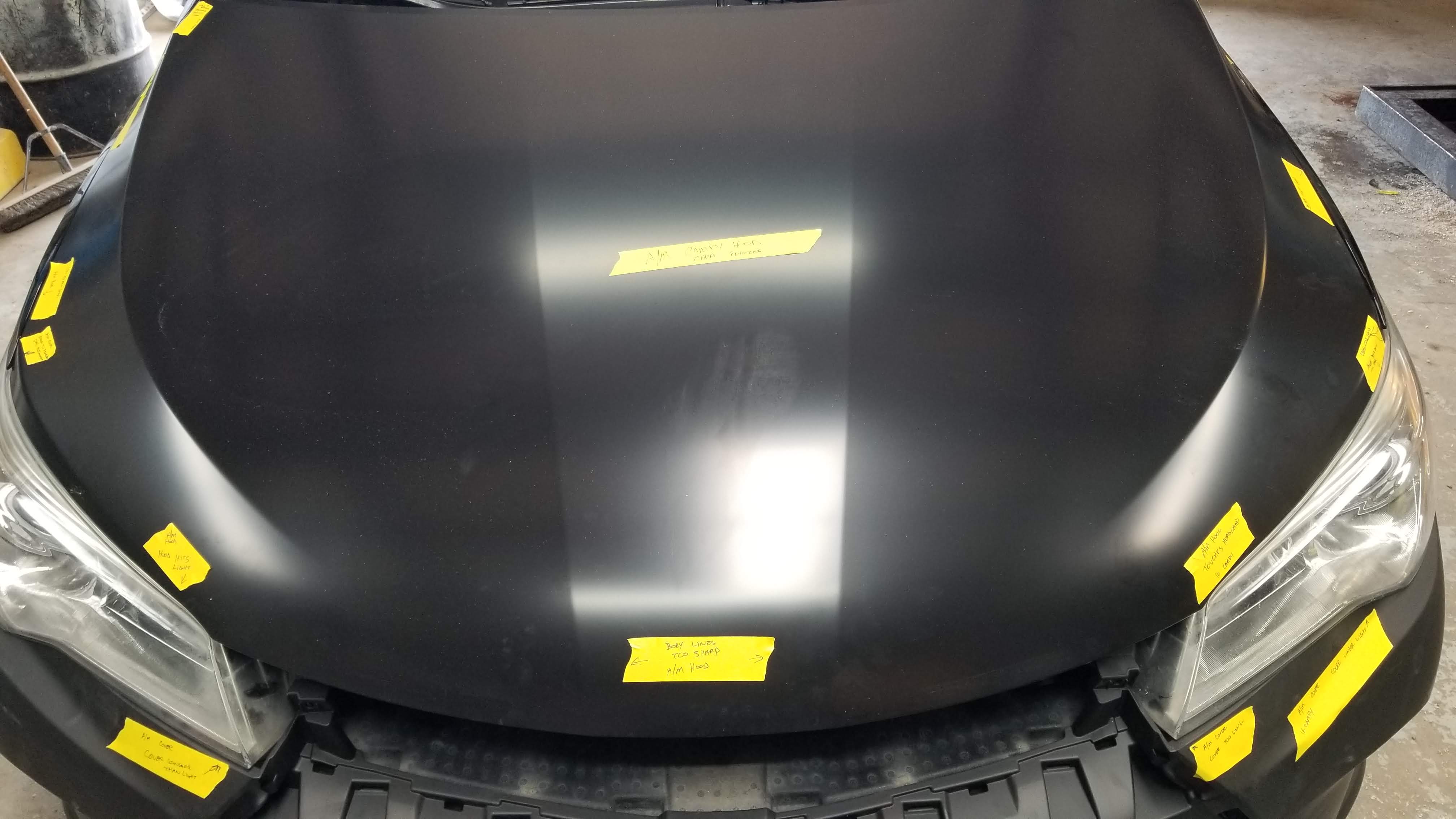 Aftermarket parts fitment issues — multiple problems documented with yellow tape at Rusty's Bodywerks